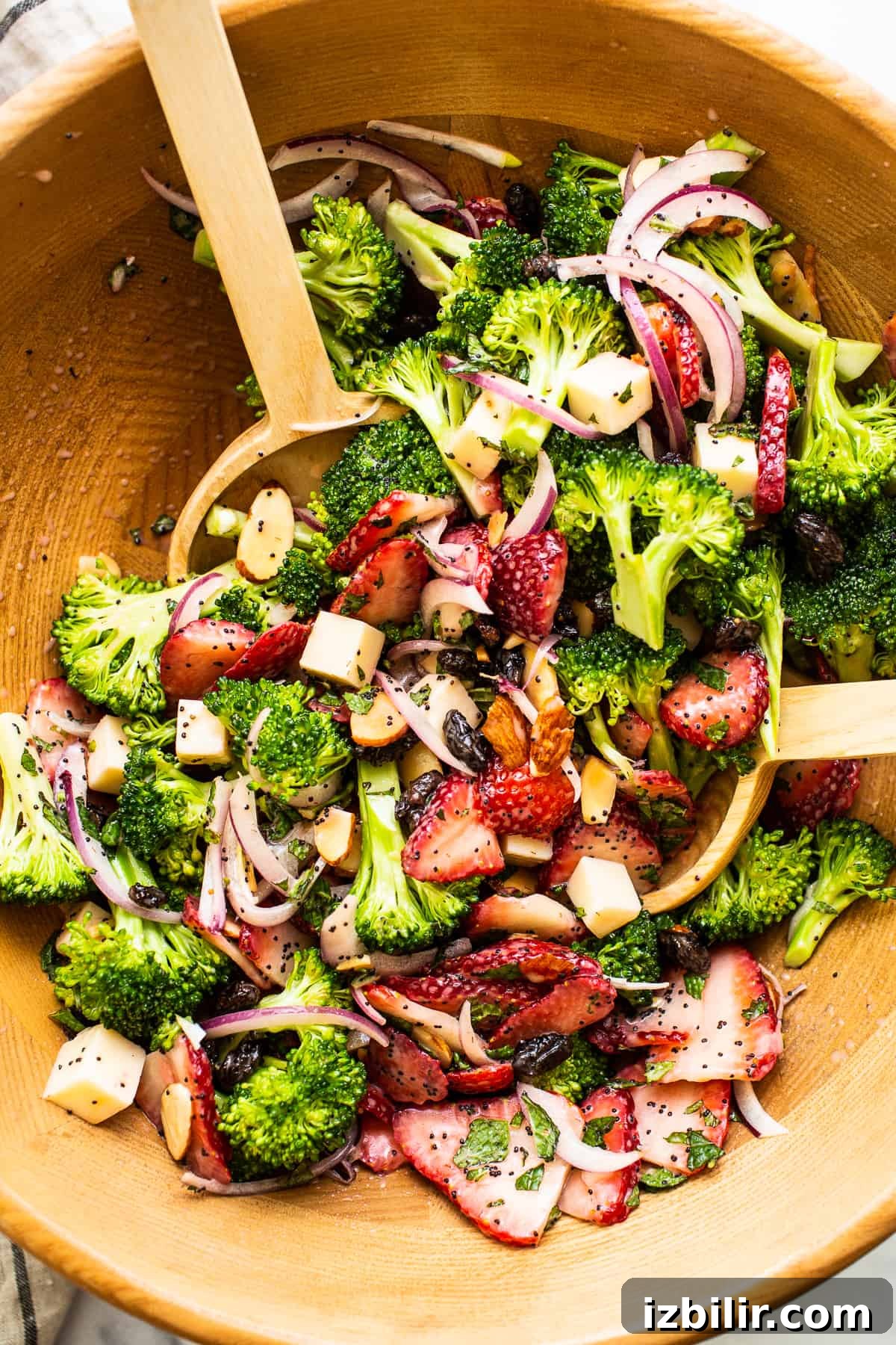 Fresh Strawberry Broccoli Salad Recipe with Poppy Seed Dressing 2 Strawberry broccoli salad in a wooden bowl.