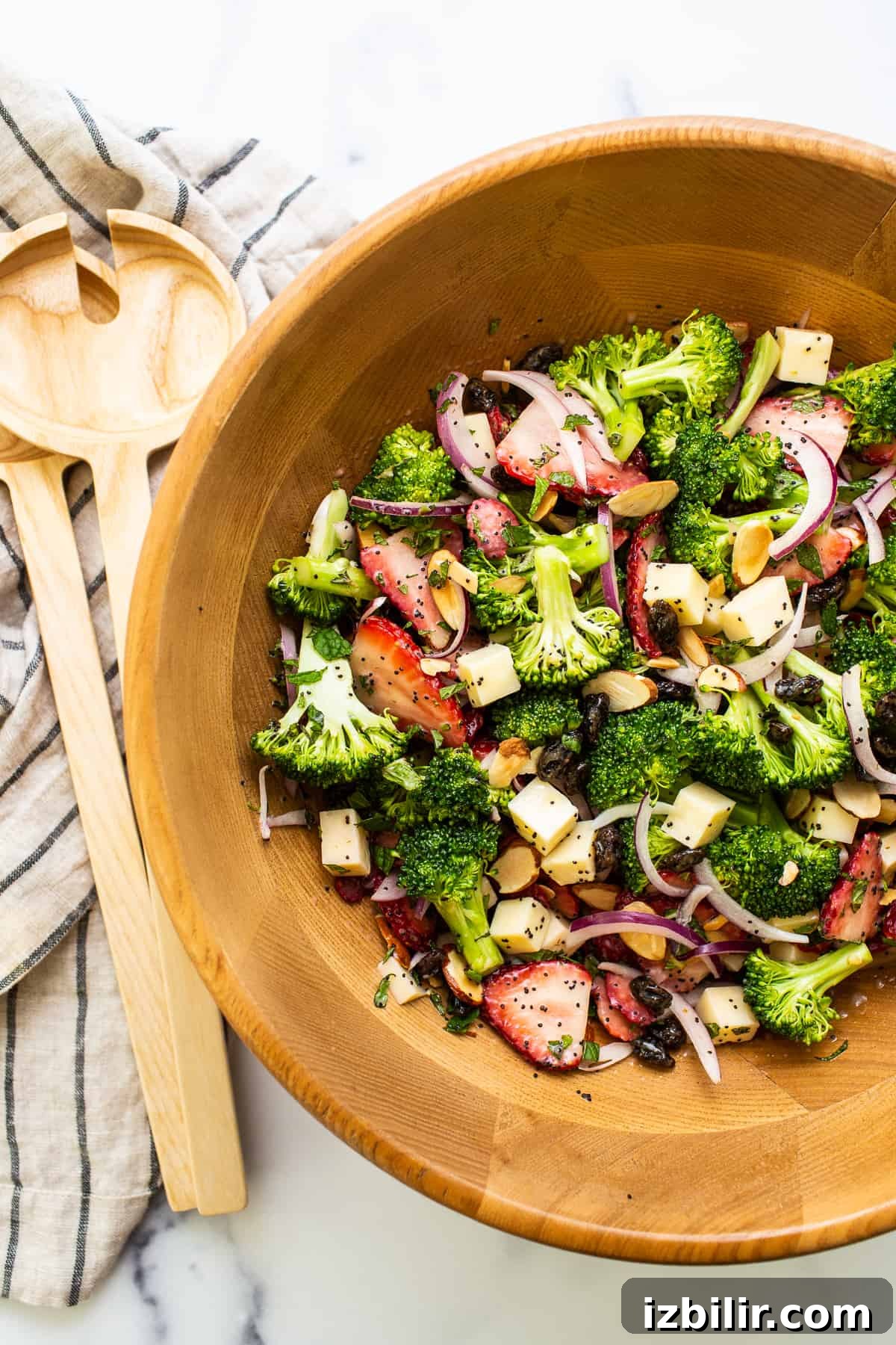 Fresh Strawberry Broccoli Salad Recipe with Poppy Seed Dressing 6 Strawberry broccoli salad in a wooden bowl.