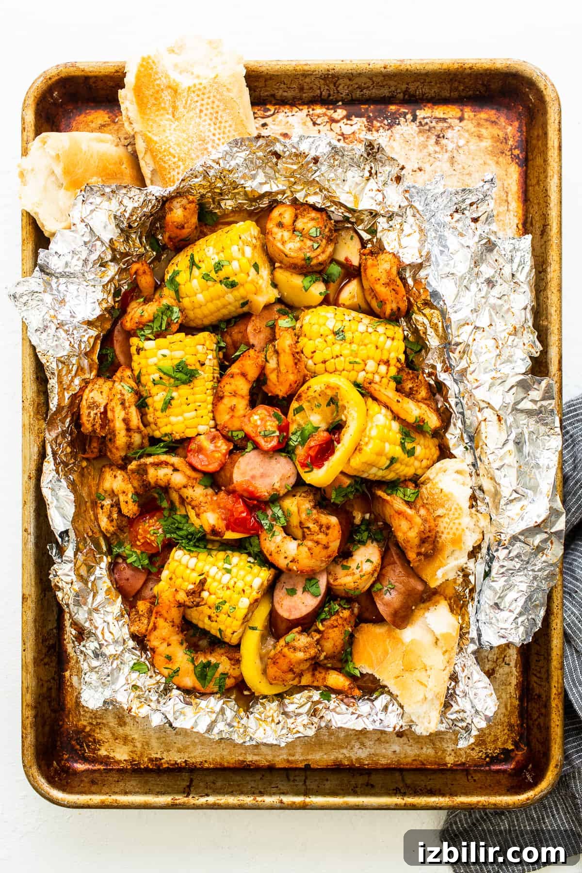 Shrimp foil packet full of ingredients.