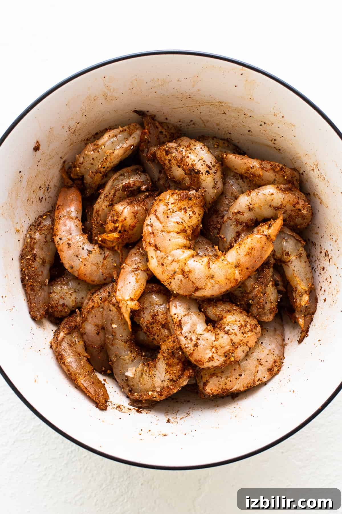 Shrimp sitting in old bay seasoning.