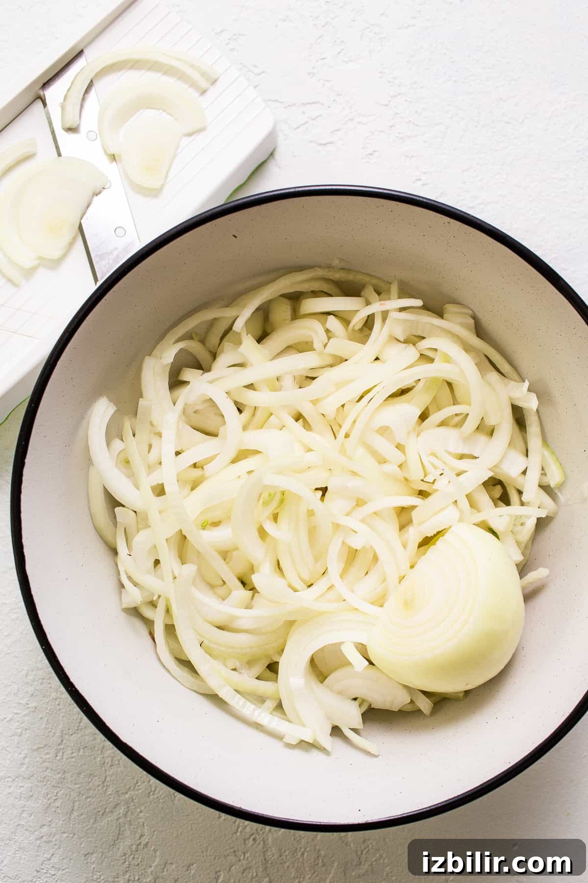 Caramelized Onions Recipe: Sweet, Golden and Versatile 3 White onions in a bowl