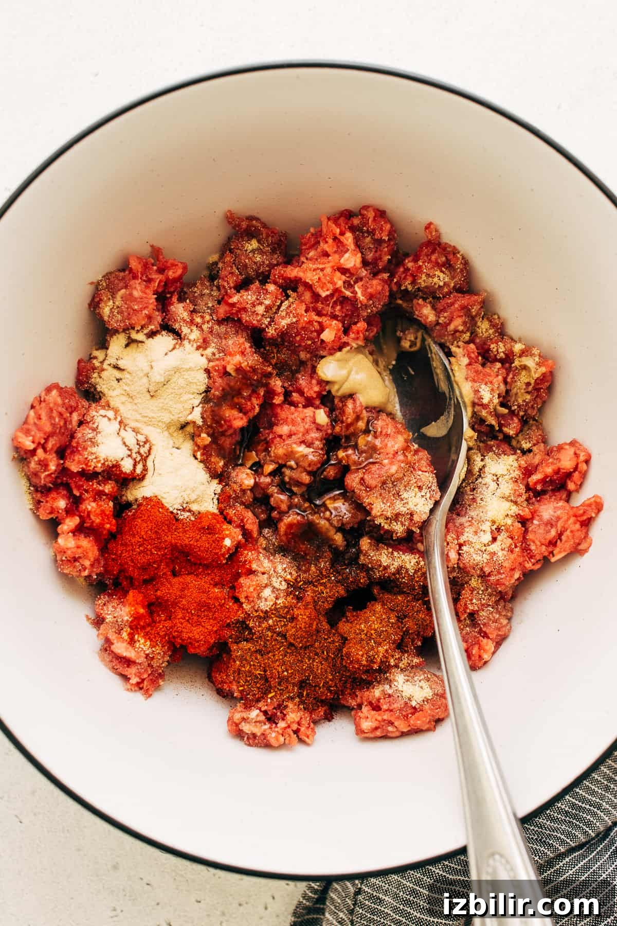 Homemade burger patty ingredients in a bowl.