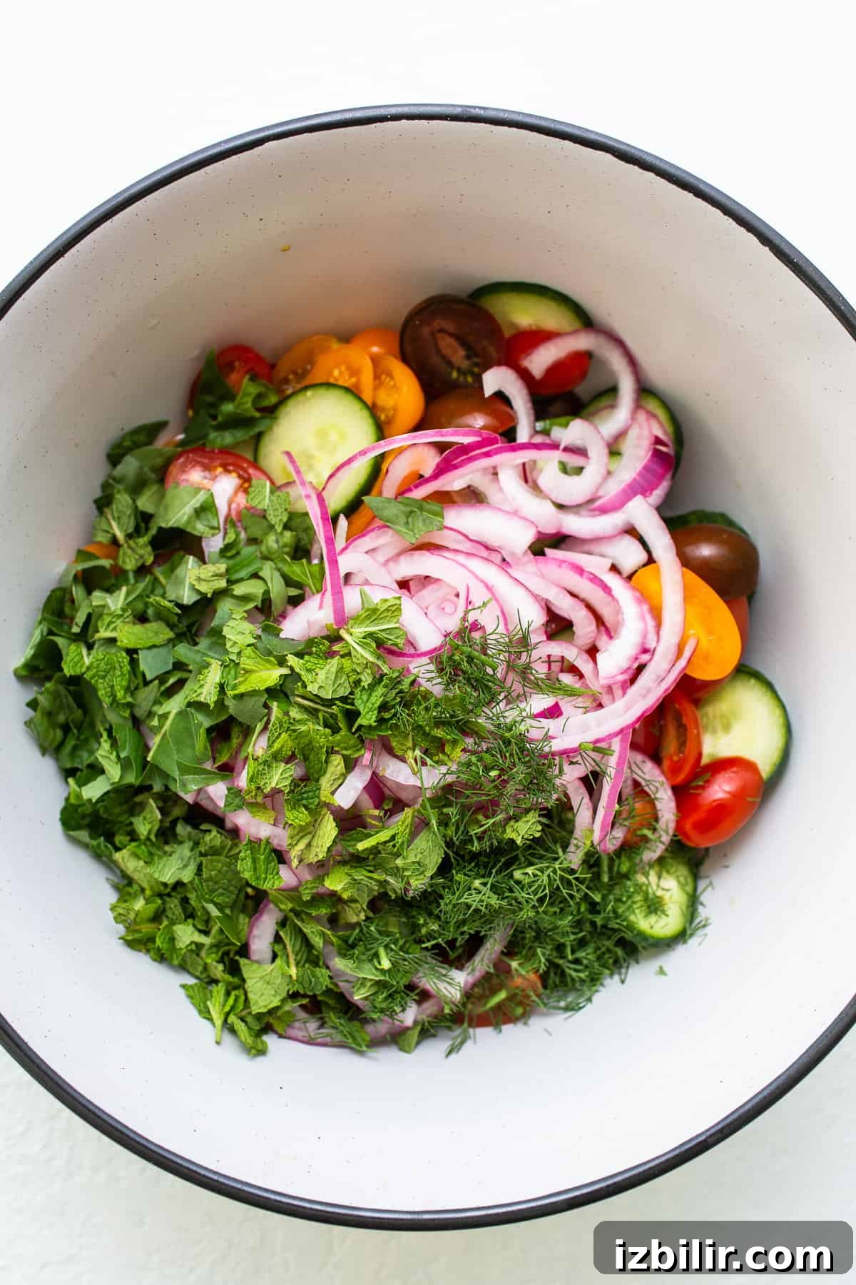 Fresh Cucumber and Tomato Salad with Herbs 5 Cucumber salad in a bowl.