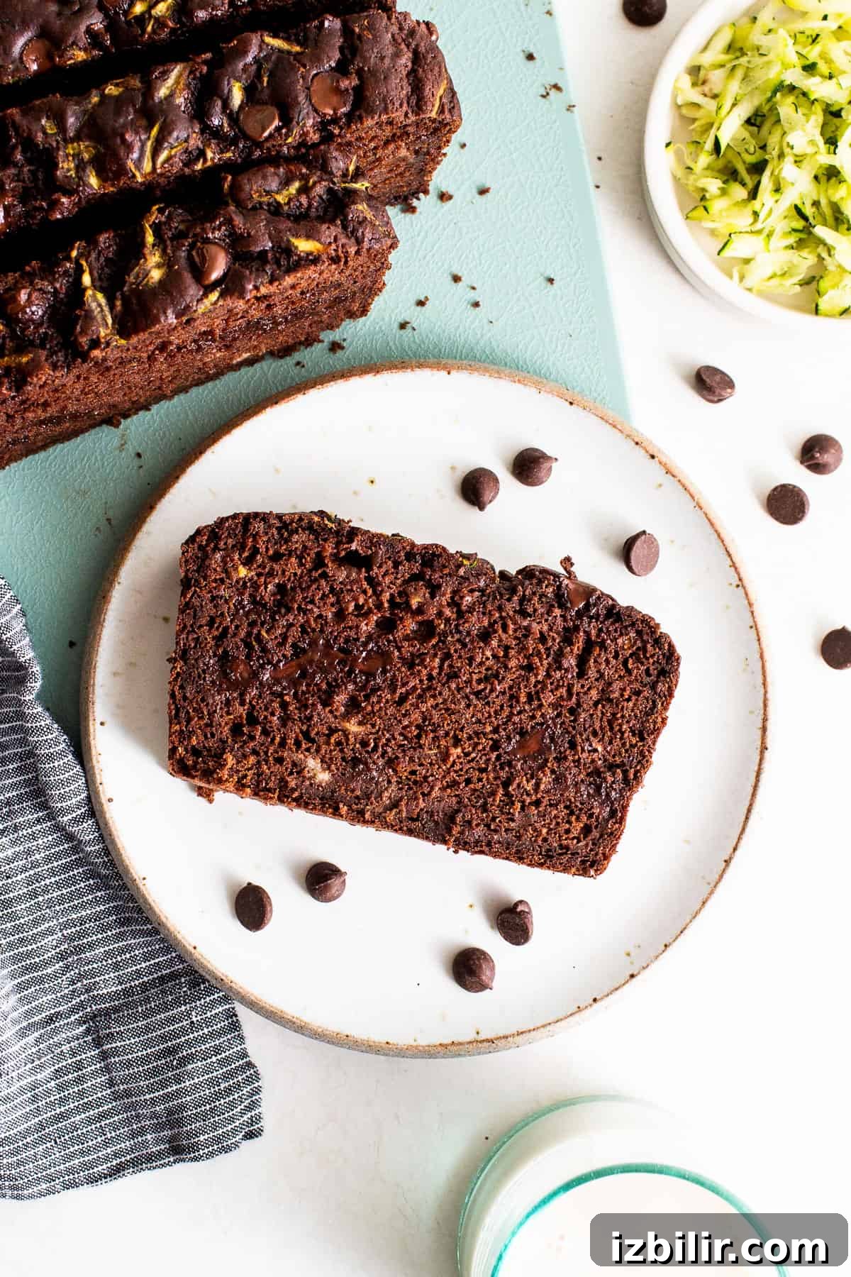Slice of chocolate zucchini bread on a plate.