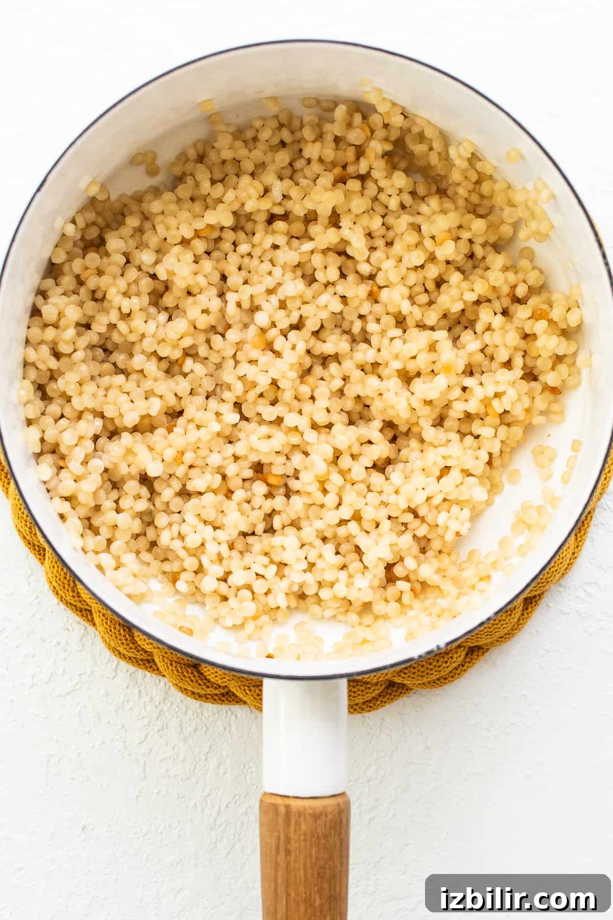Israeli couscous in pot.
