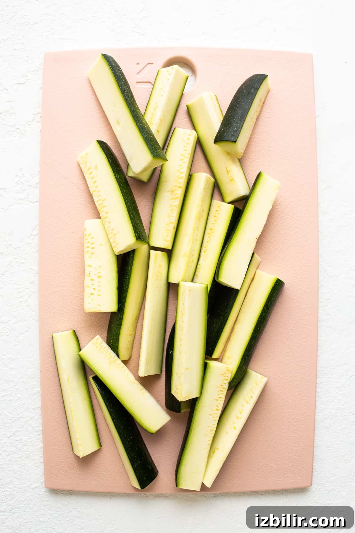 zucchini spears on cutting board.