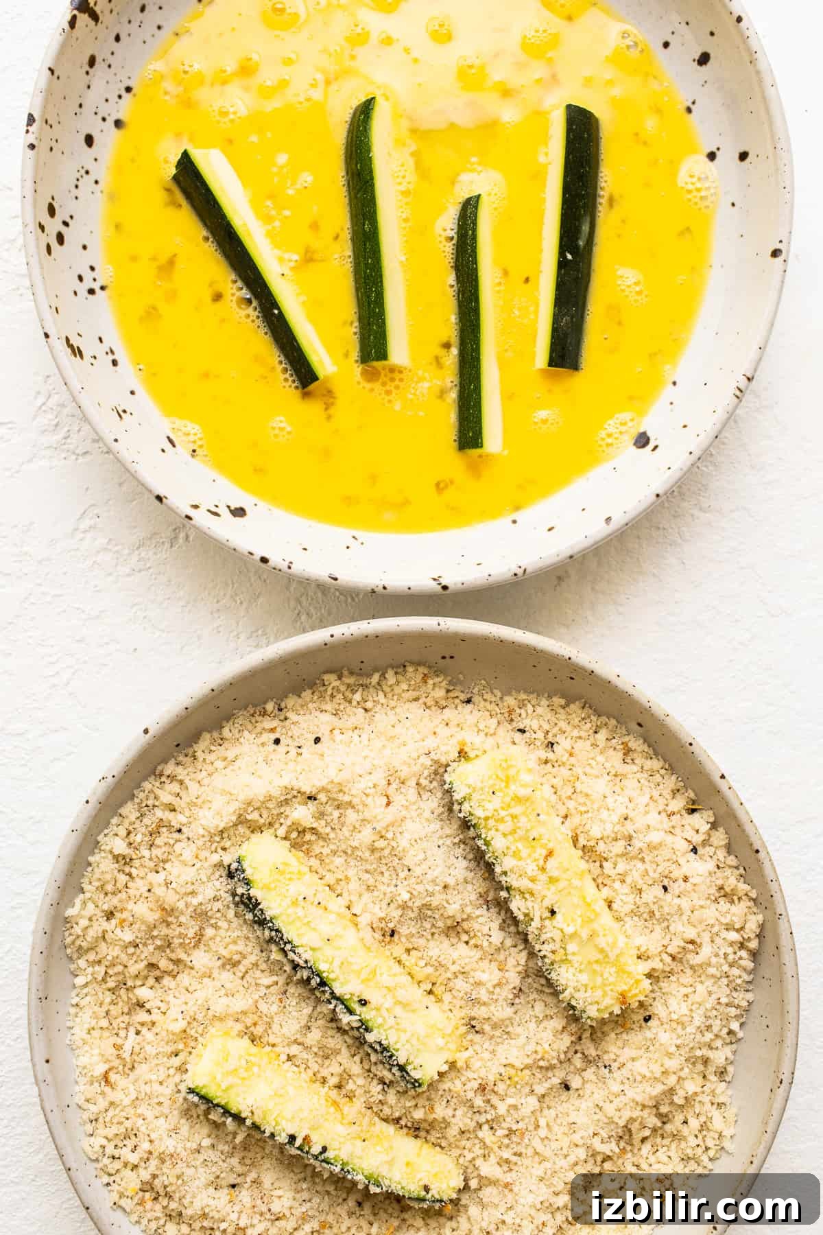 dipping zucchini in panko.