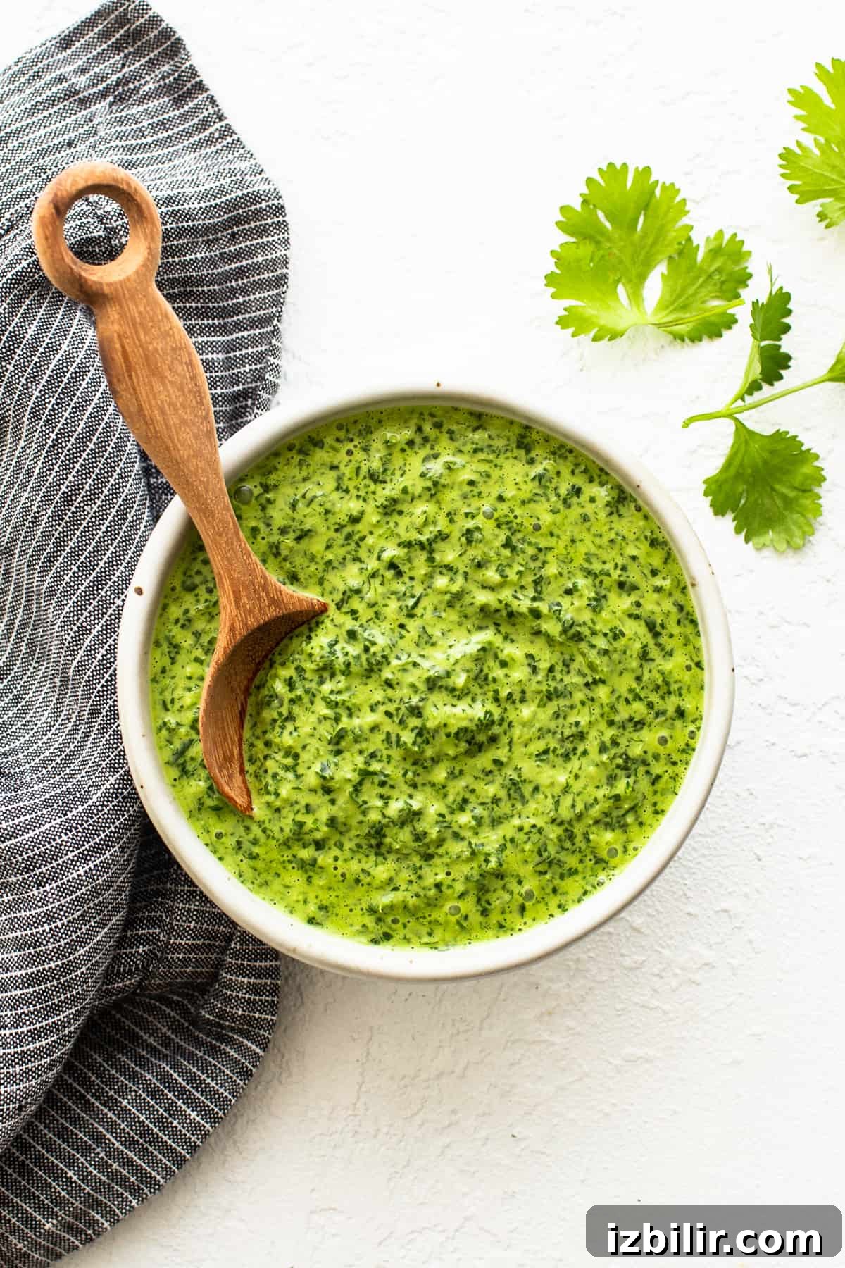green sauce in bowl with spoon.