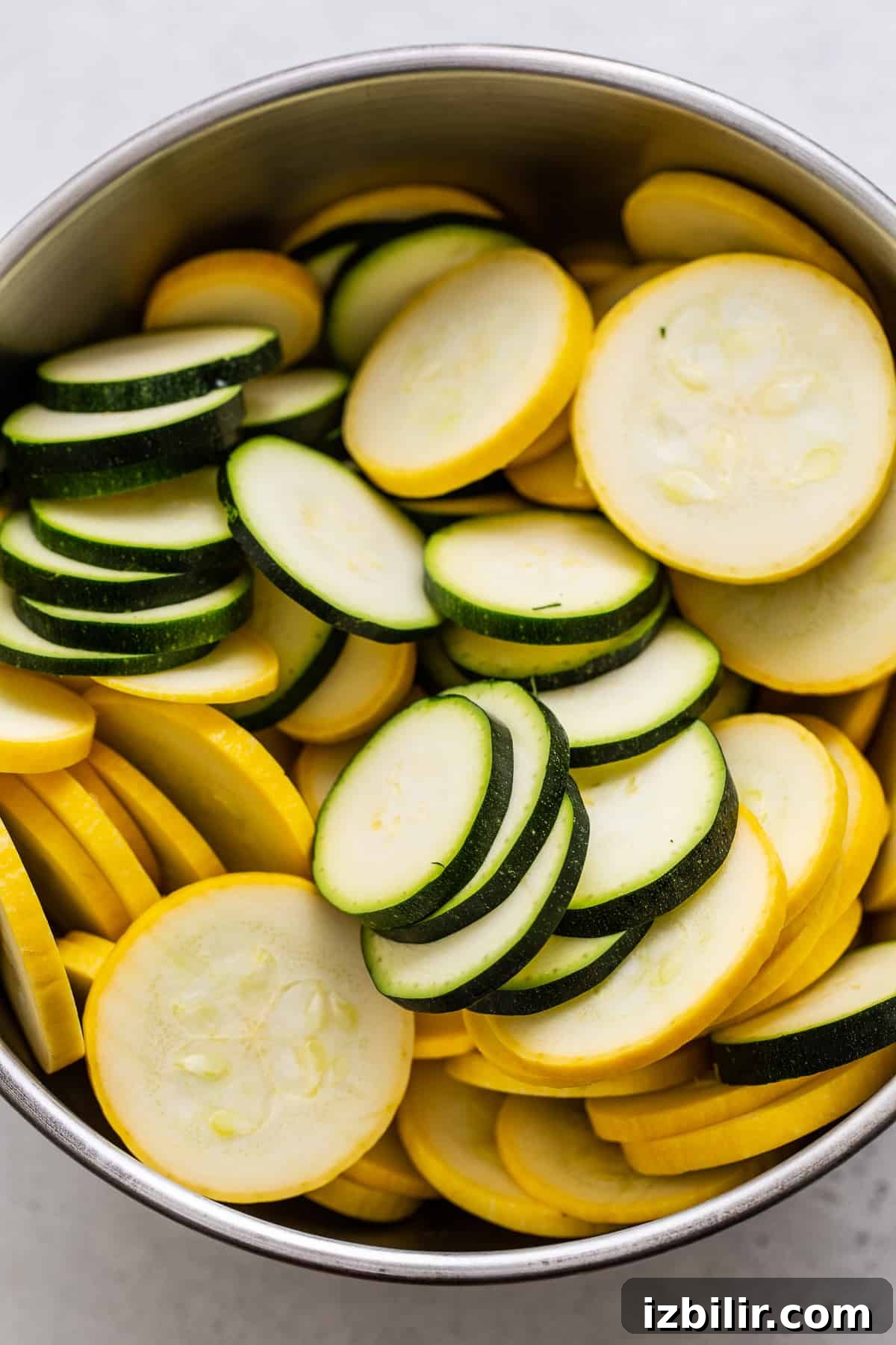 Summer Squash Pasta with Lemon, Garlic and Parmesan 3 Sliced squash and zucchini in a bowl.