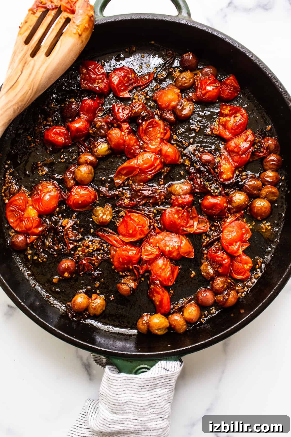 Creamy Burrata with Bursting Cherry Tomatoes Recipe 4 cooked down cherry tomatoes in skillet.