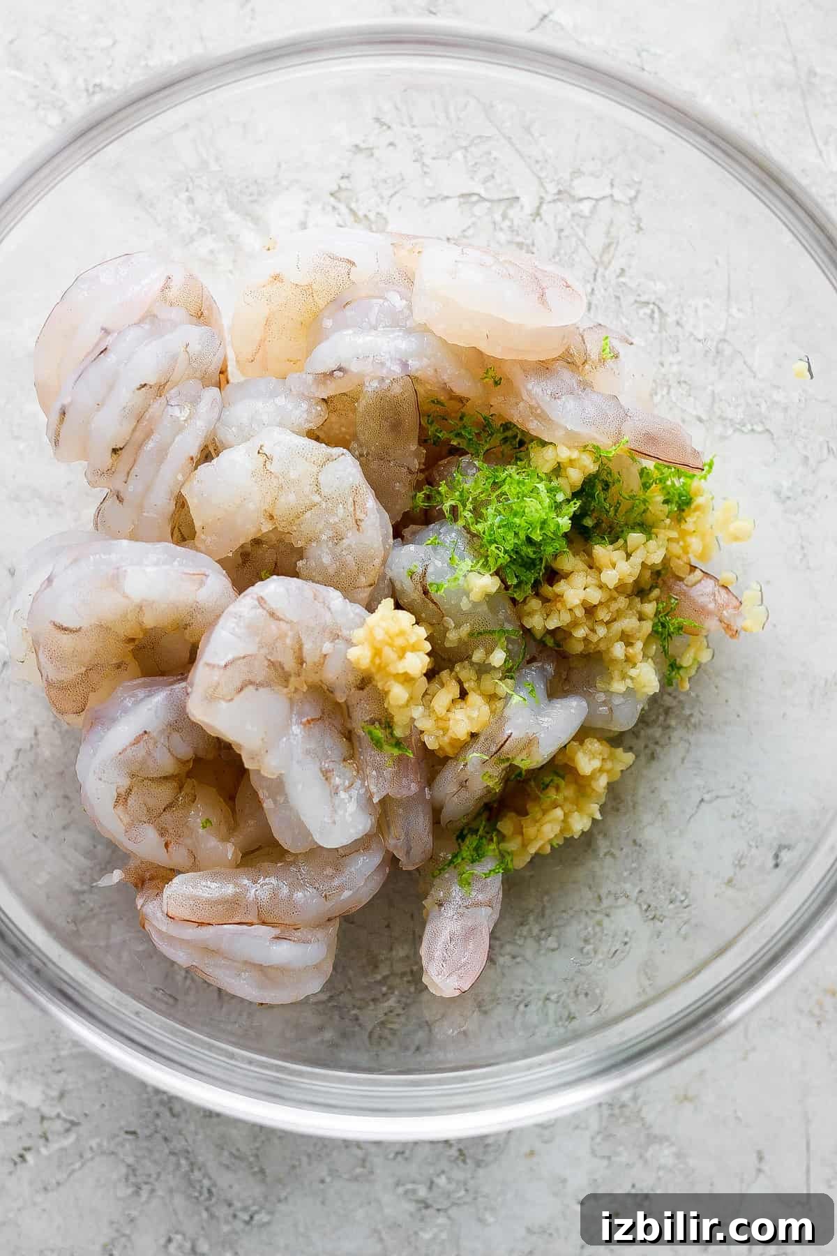 Cilantro Lime Shrimp Rice Bowls with Avocado 3 Prawns in a bowl with parsley and paprika.