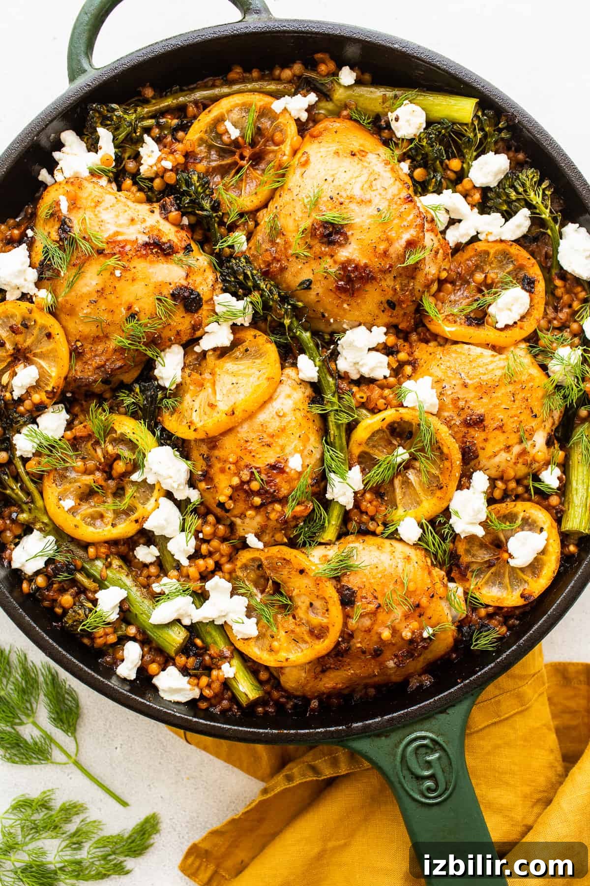 Lemon Chicken Skillet with couscous and broccolini Lemon chicken skillet topped with goat cheese.
