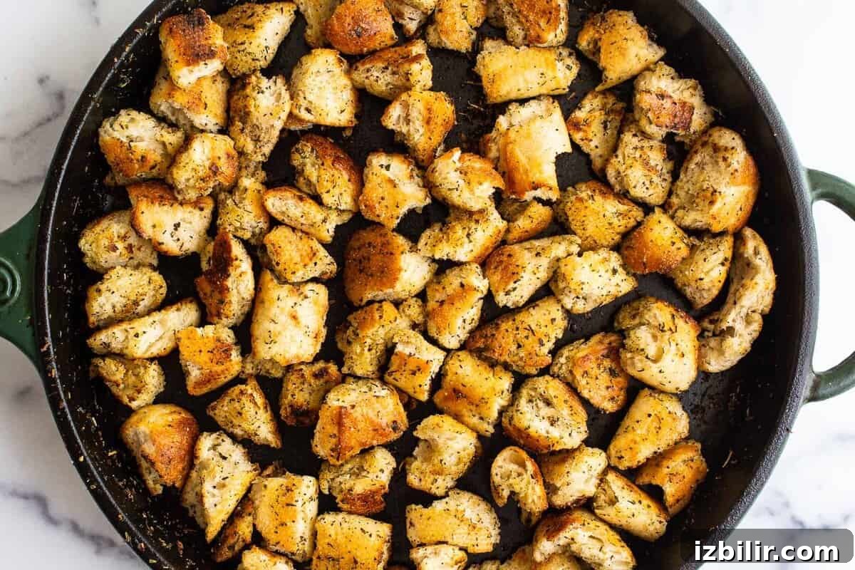 Croutons in cast iron skillet.