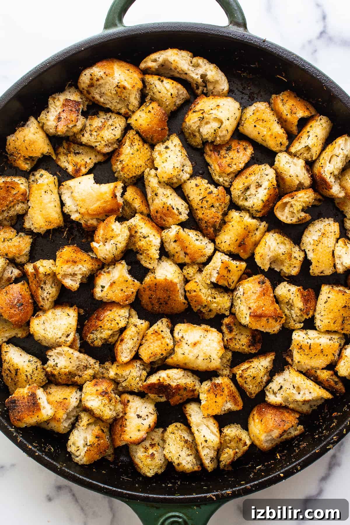 Croutons in cast iron skillet.
