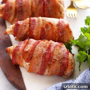 Crispy Bacon-Wrapped Chicken Salad Recipe 2 bacon wrapped chicken on cutting board