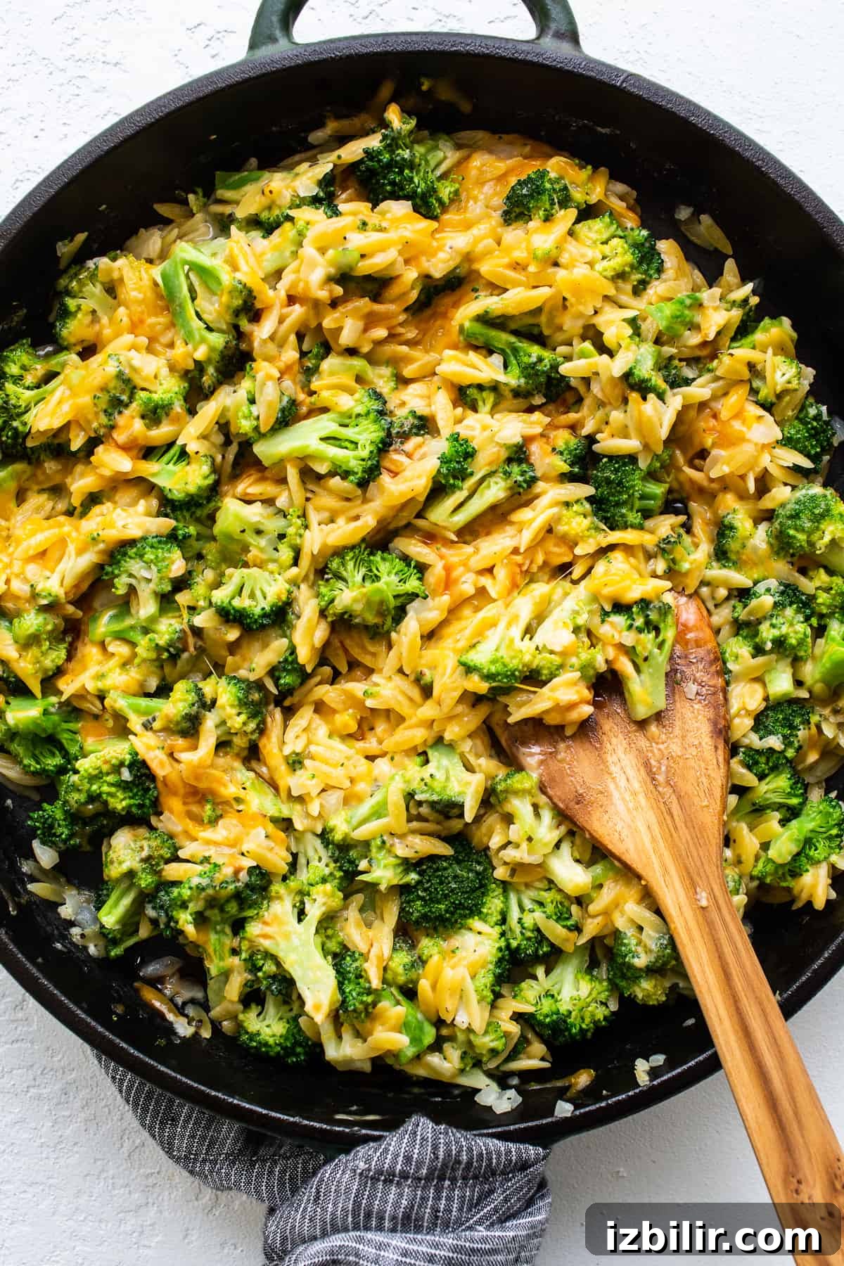 Cheesy broccoli casserole in skillet.