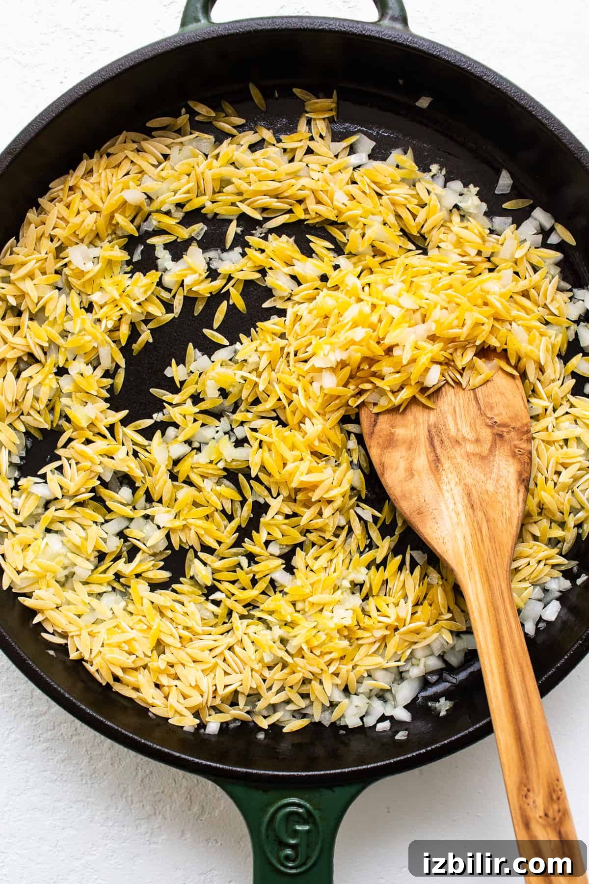toasting orzo in skillet.