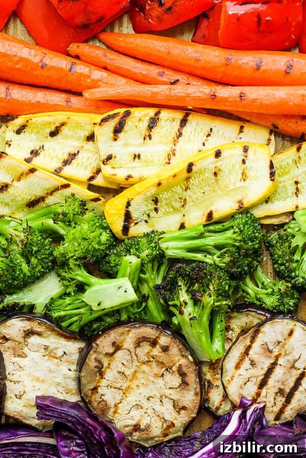a variety of vegetables laid out on a cutting board.