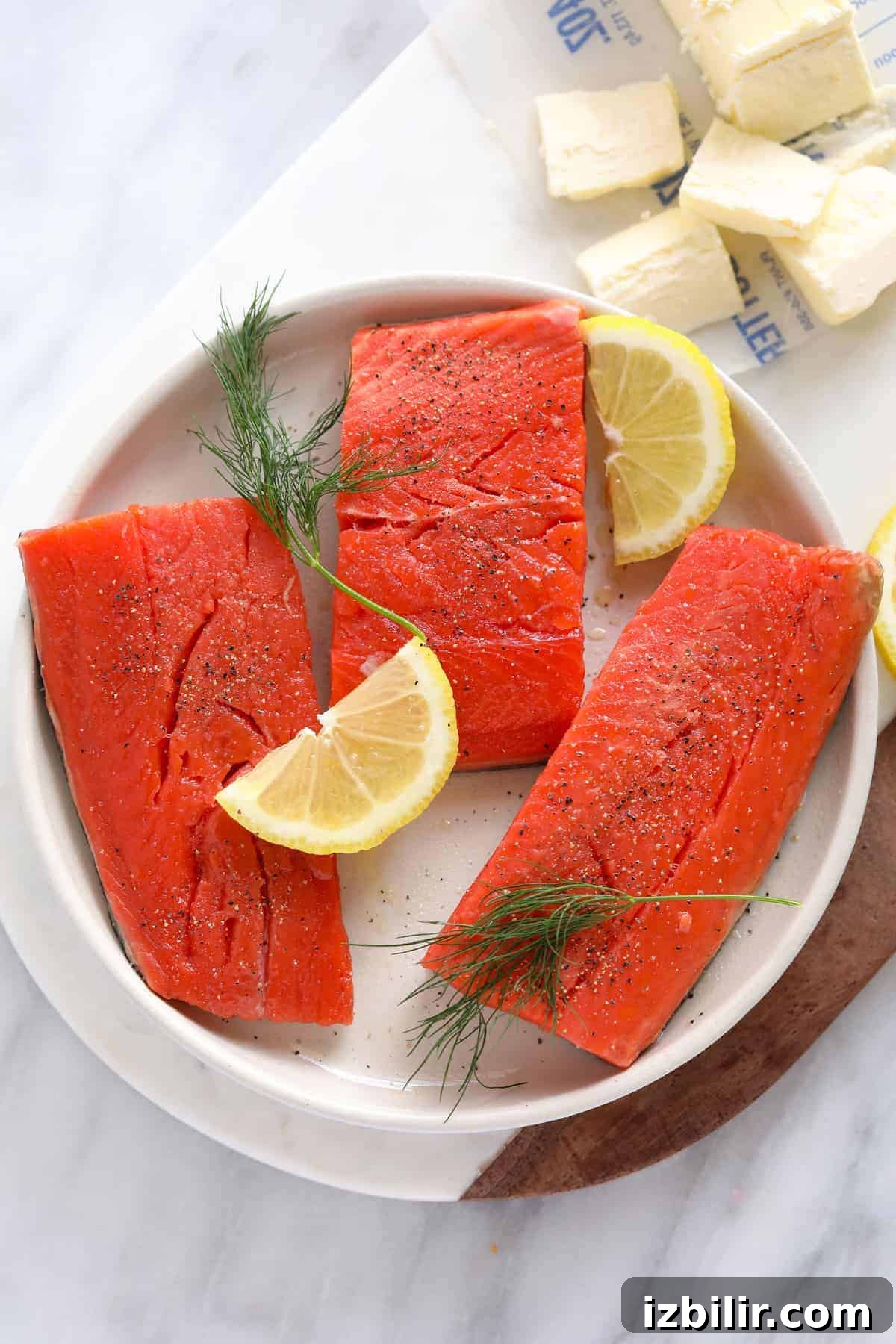 Pan Seared Salmon with Crispy Skin and Lemon Butter 3 Uncooked salmon fillets with lemon and dill