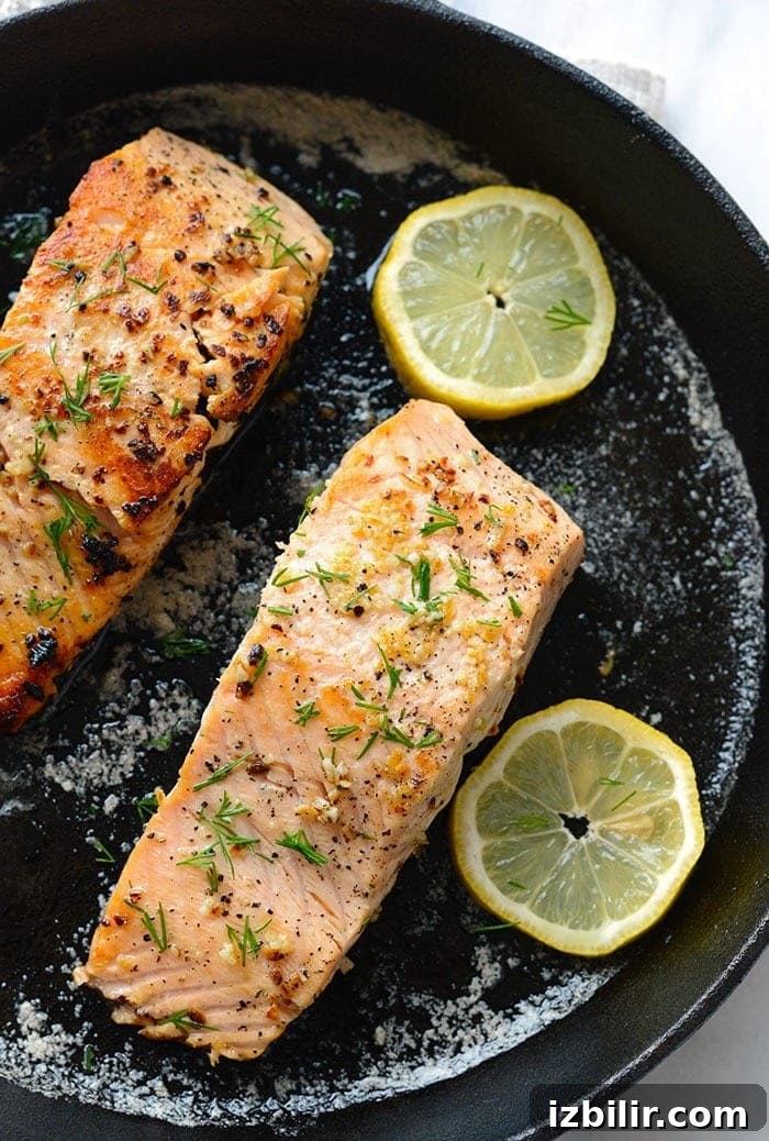 Pan Seared Salmon with Crispy Skin and Lemon Butter 4 Pan seared salmon with lemon in a cast iron pan
