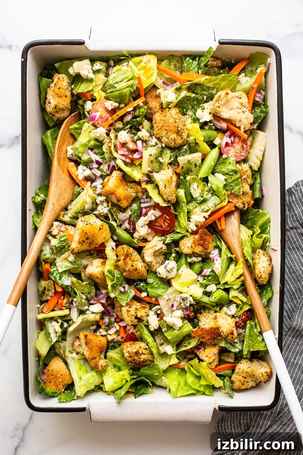 Tossed garden salad Garden salad tossed in a serving dish.