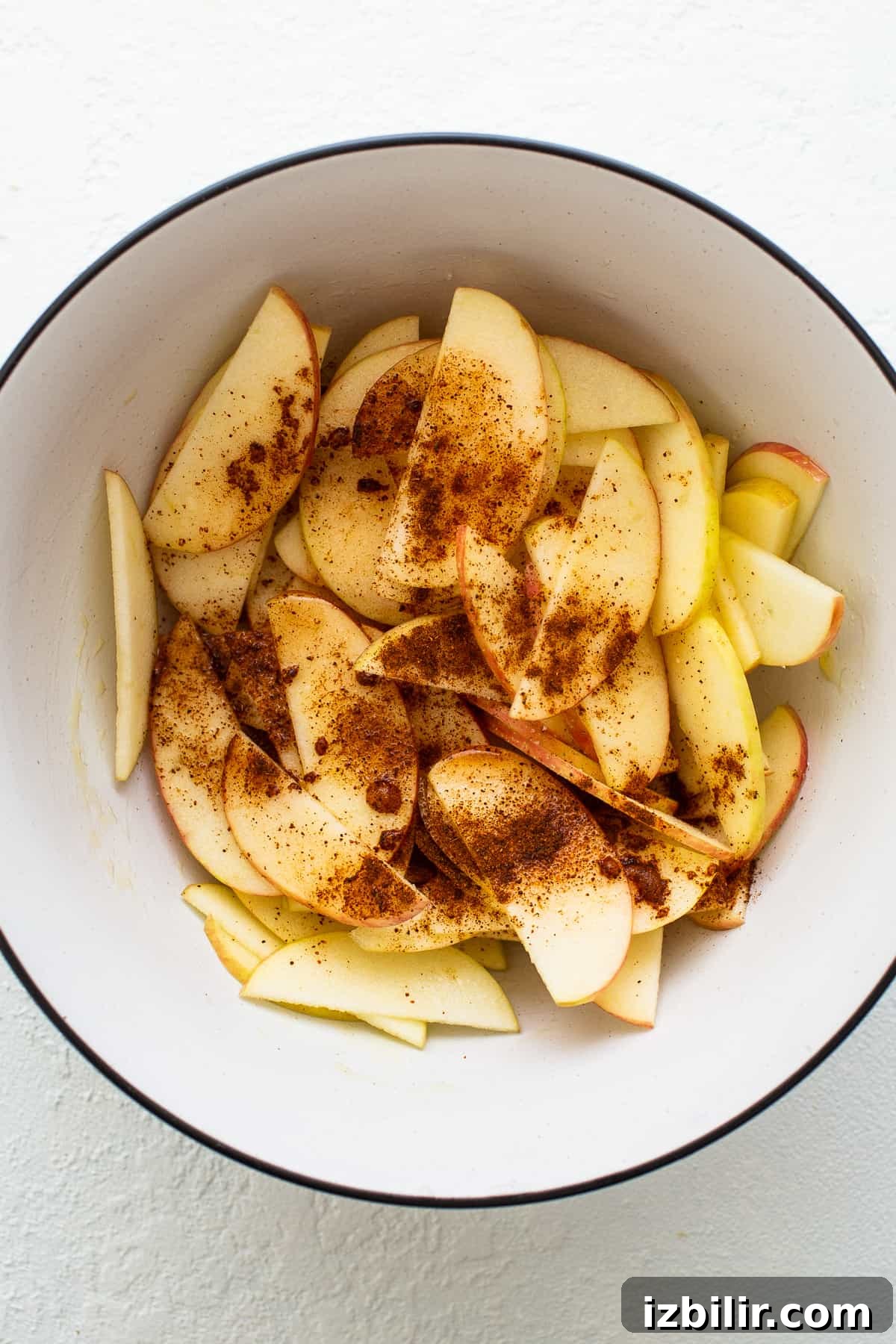Apples and spices in a bowl.