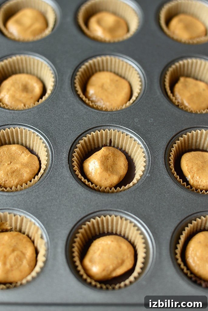 High Protein Peanut Butter Cups Recipe 2 peanut butter cups in muffin tin.