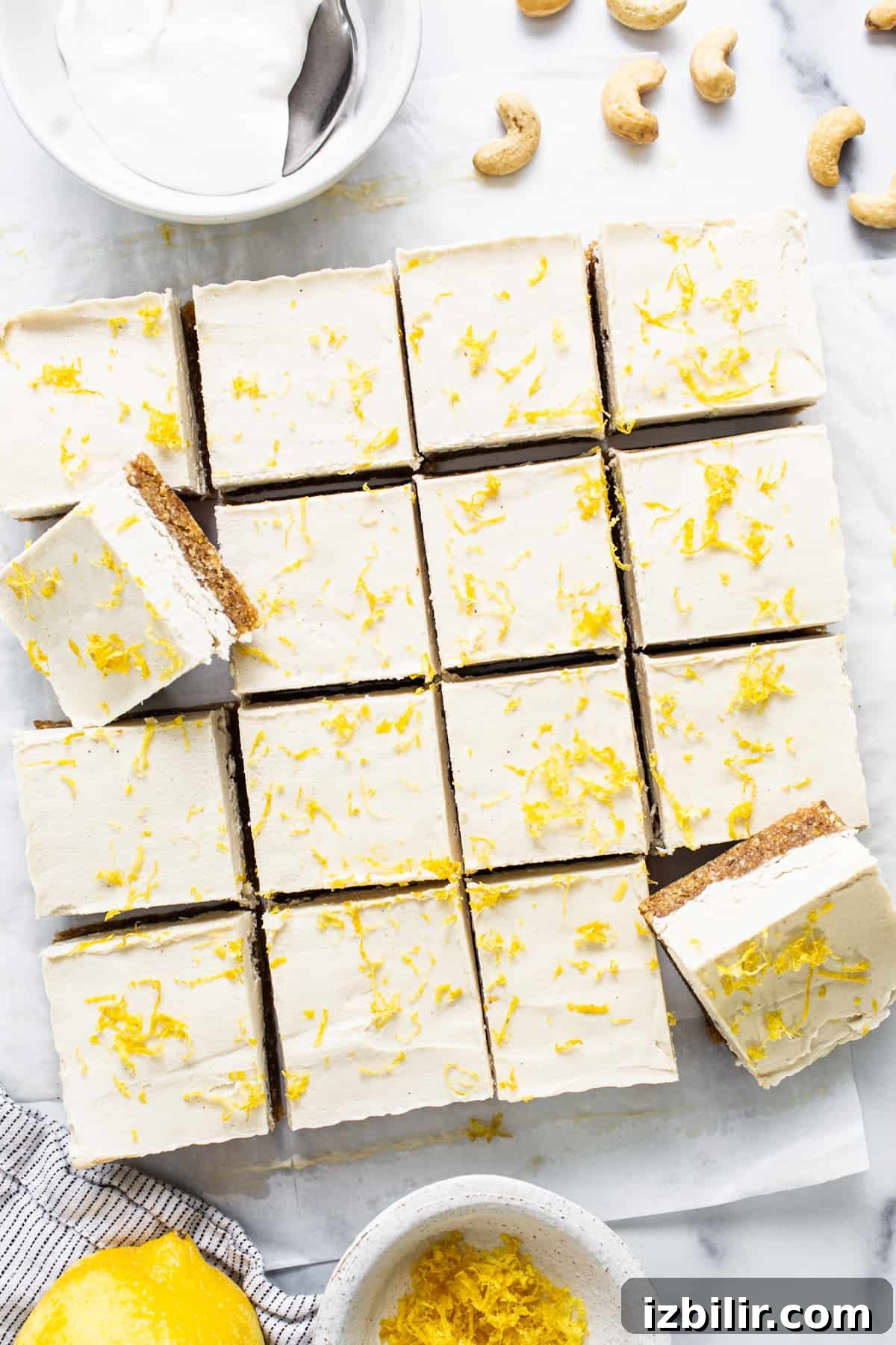 lemon bars with cashew cream and cashew nuts.