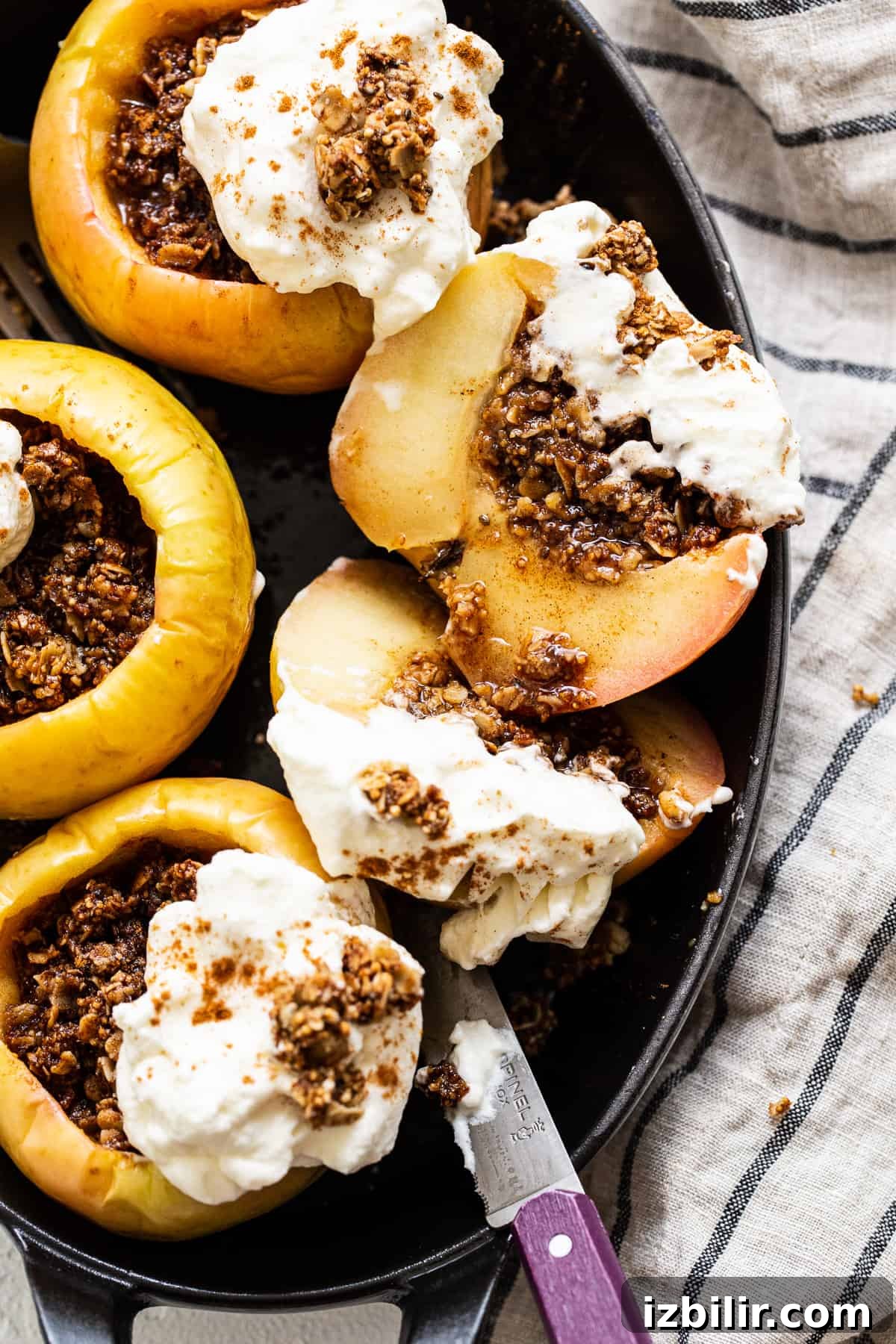 Baked apples topped with whipped cream. Baked apples topped with whipped cream.