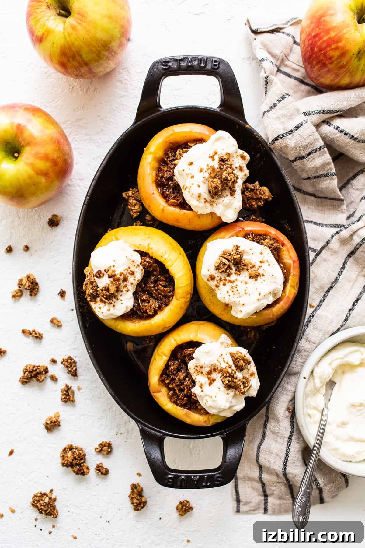 Baked apples topped with whipped cream. Baked apples topped with whipped cream.