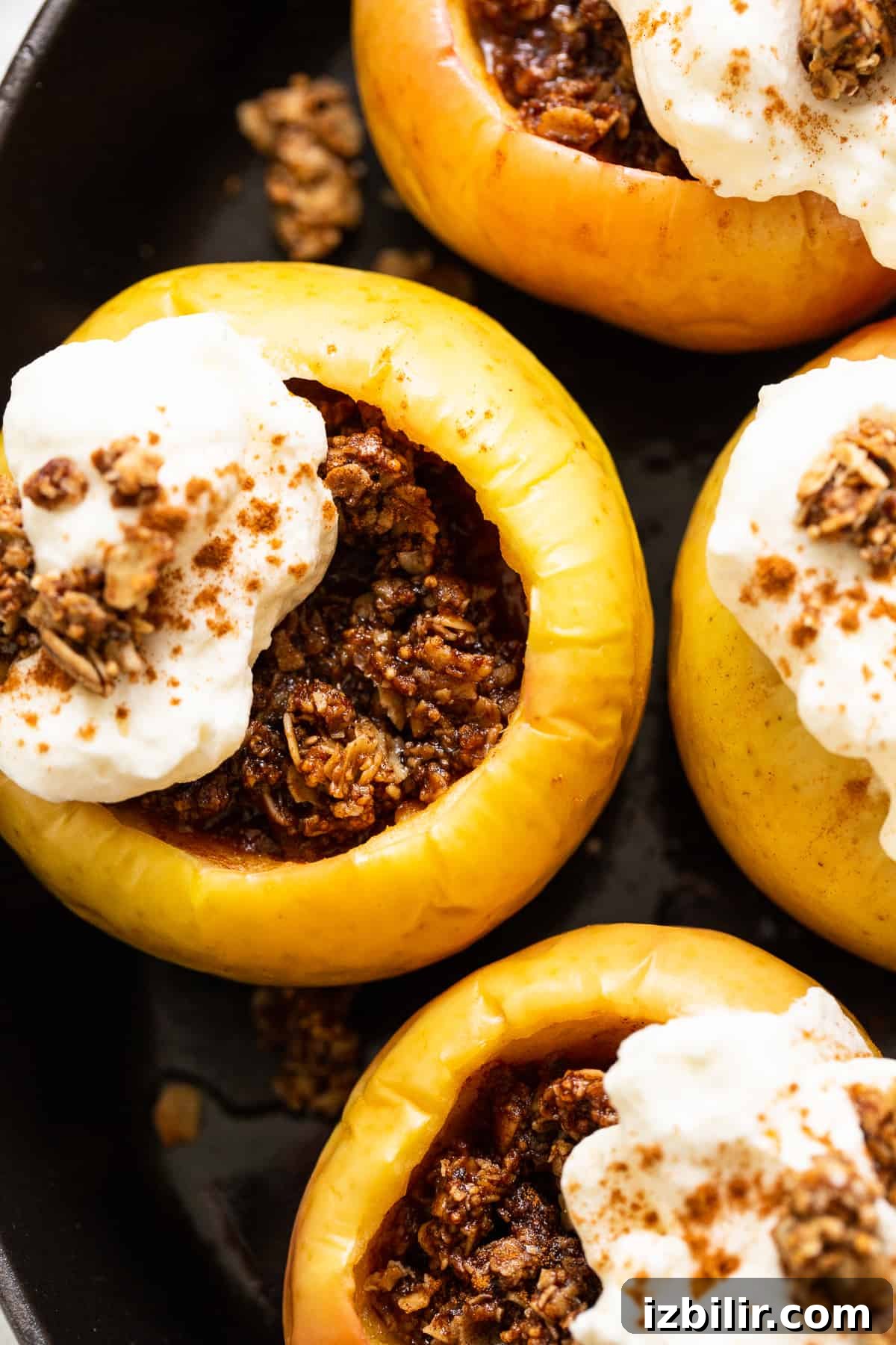 Baked apple topped with whipped cream. Baked apple topped with whipped cream.