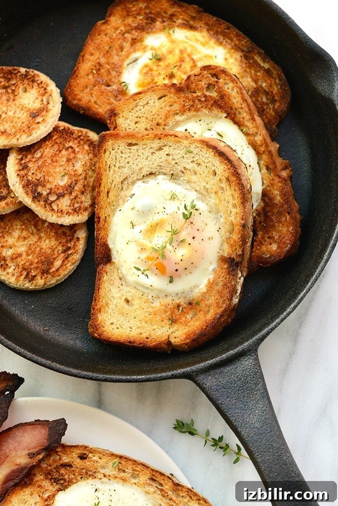 Egg in a frame cooking in a cast iron pan egg in a frame in cast iron pan