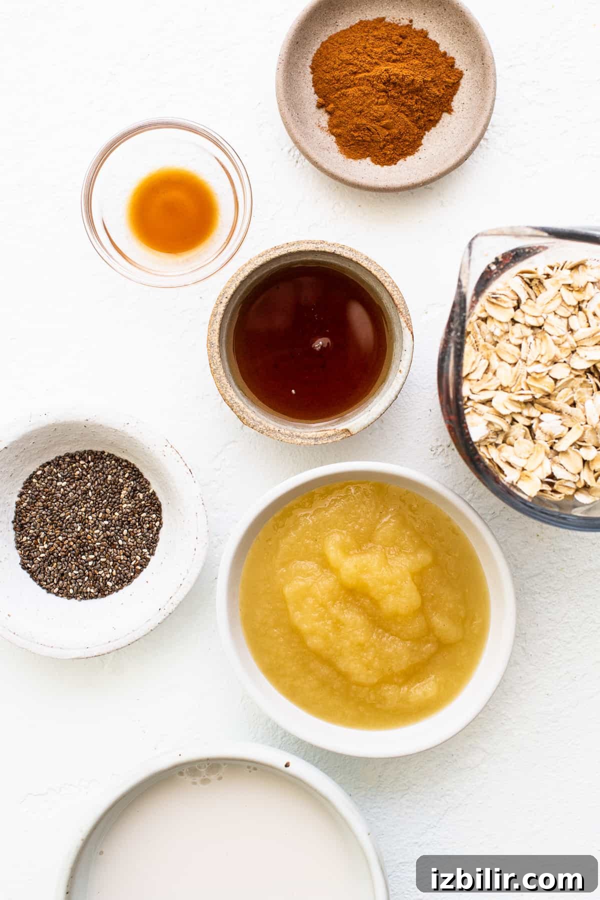 Ingredients for apple cinnamon oatmeal in bowls.