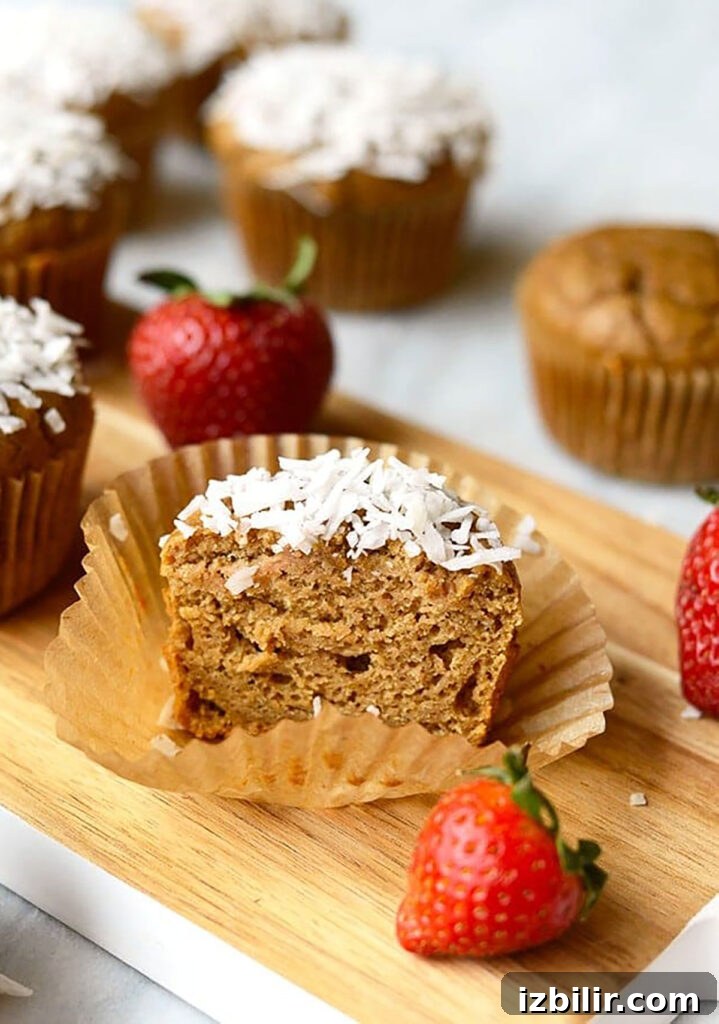 Strawberry Banana Blender Muffins: One-Bowl Recipe 5 Coconut blender muffins with strawberries on a cutting board