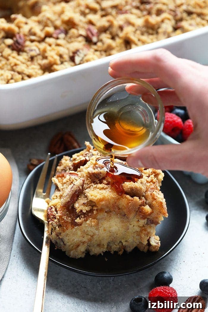 Pouring syrup on french toast bake