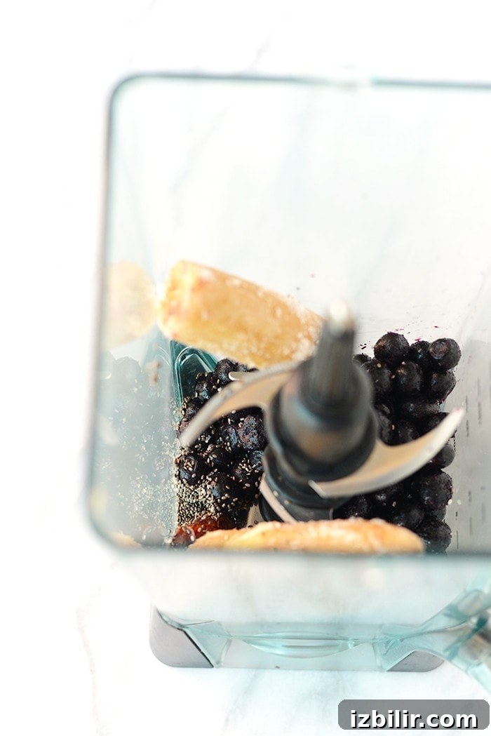 Smoothies are best eaten with a spoon! Make this thick and delicious Blueberry Date Smoothie Bowl and top it with all your favorite things for a quick breakfast or snack!