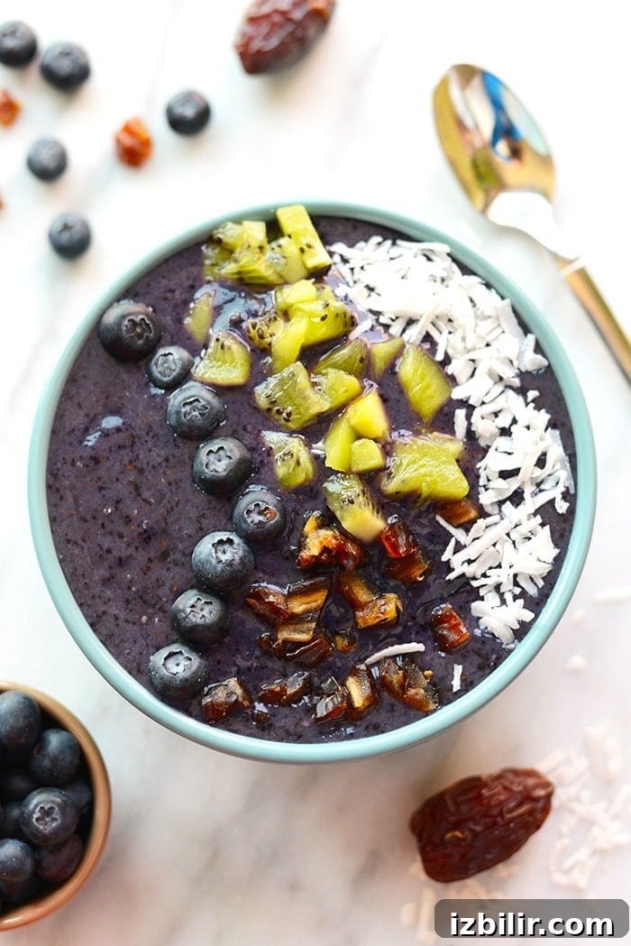 Smoothies are best eaten with a spoon! Make this thick and delicious Blueberry Date Smoothie Bowl and top it with all your favorite things for a quick breakfast or snack!