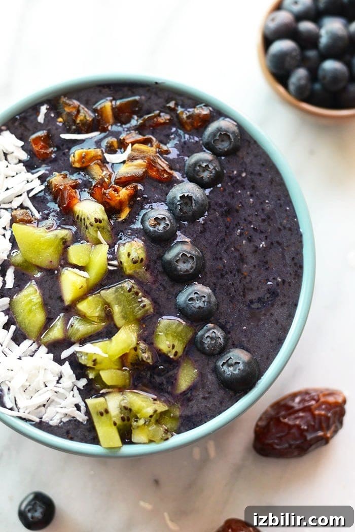 Smoothies are best eaten with a spoon! Make this thick and delicious Blueberry Date Smoothie Bowl and top it with all your favorite things for a quick breakfast or snack!