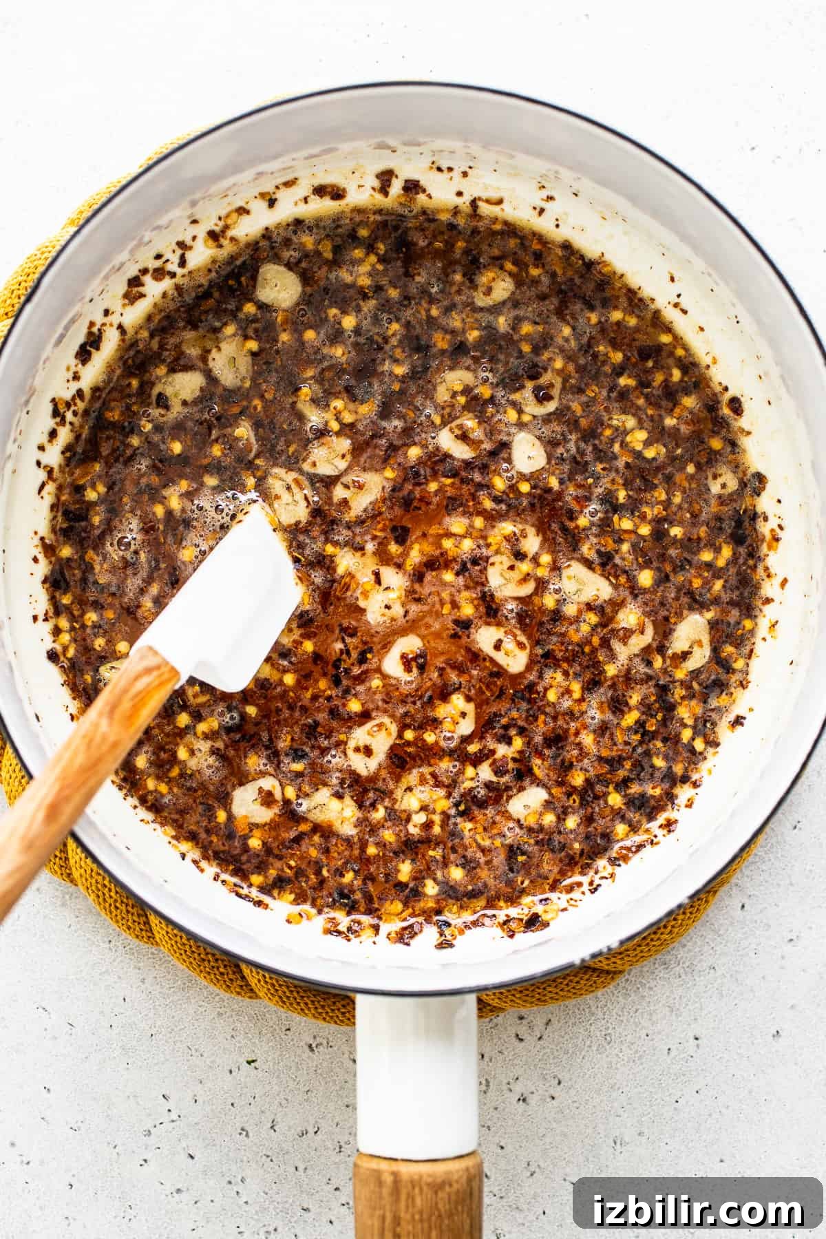 Hot honey simmering in a pan Hot honey in pan.