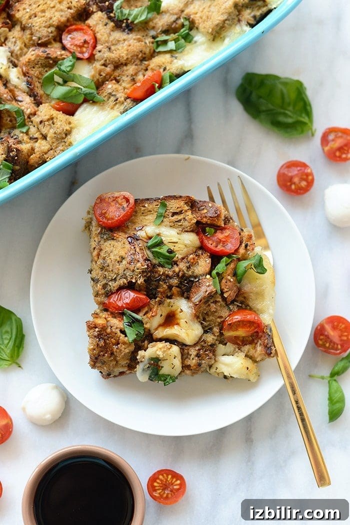 Caprese Egg Bake served on a plate with basil and balsamic drizzle.