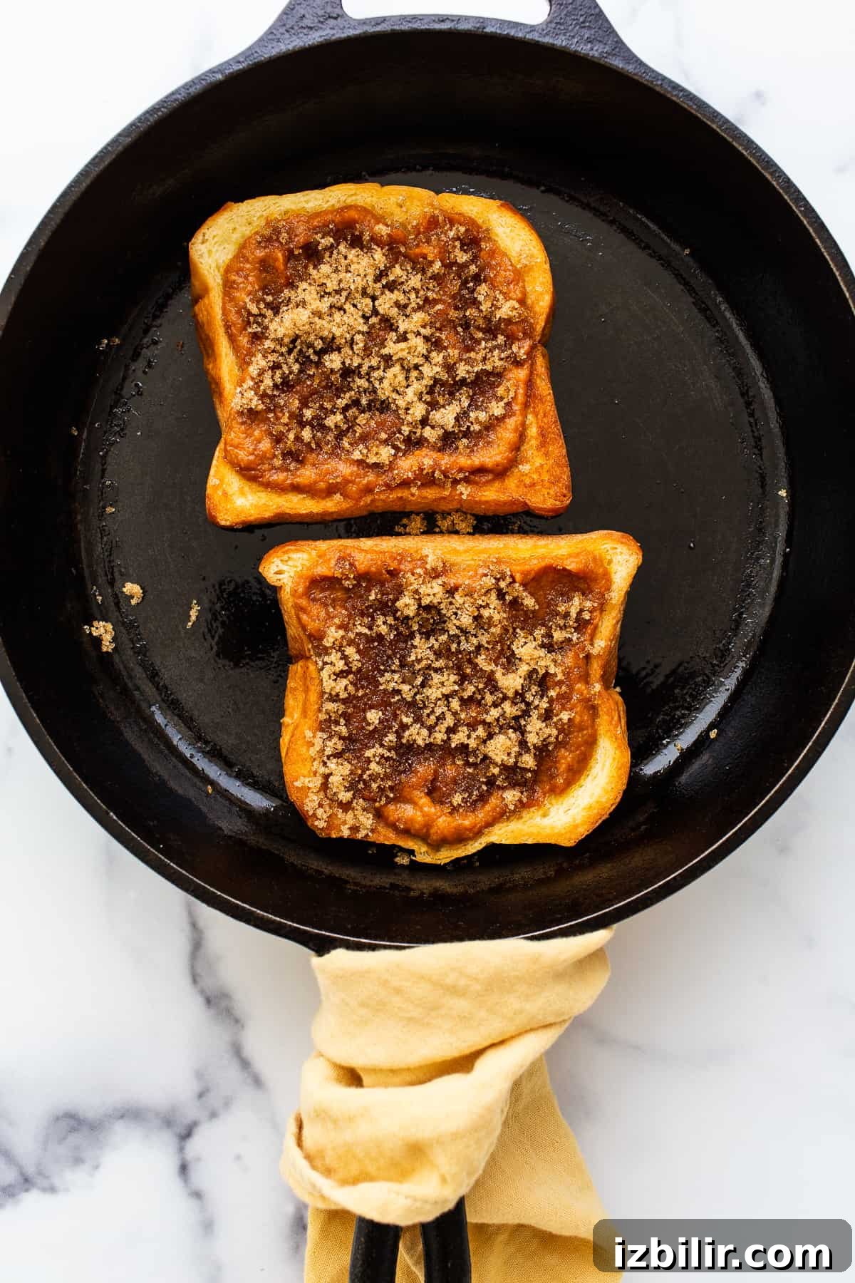 Pumpkin Creme Brûlée French Toast in skillet Pumpkin creme brulee french toast in a cast iron skillet.