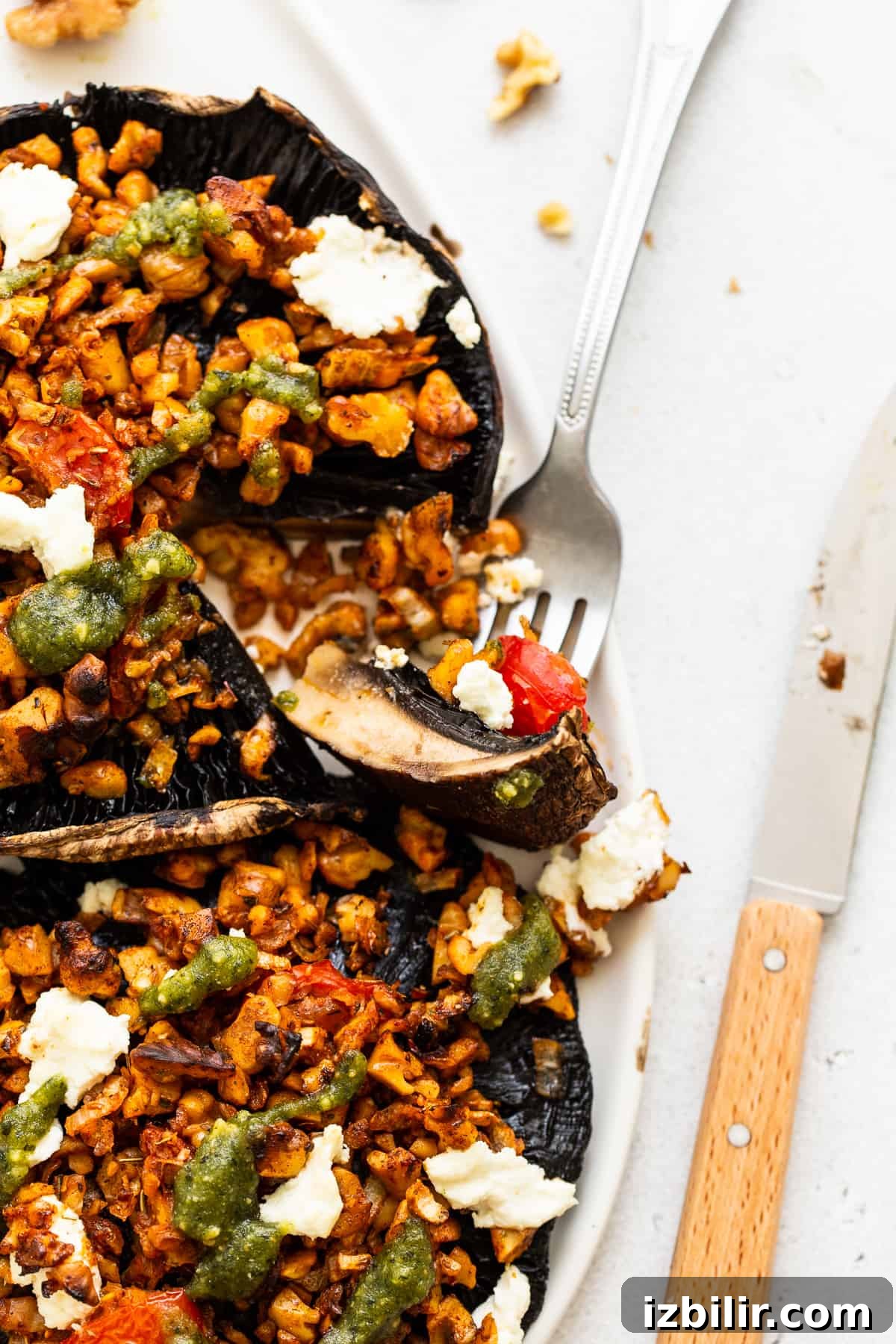 A bit of a stuffed portobello mushroom on a fork.