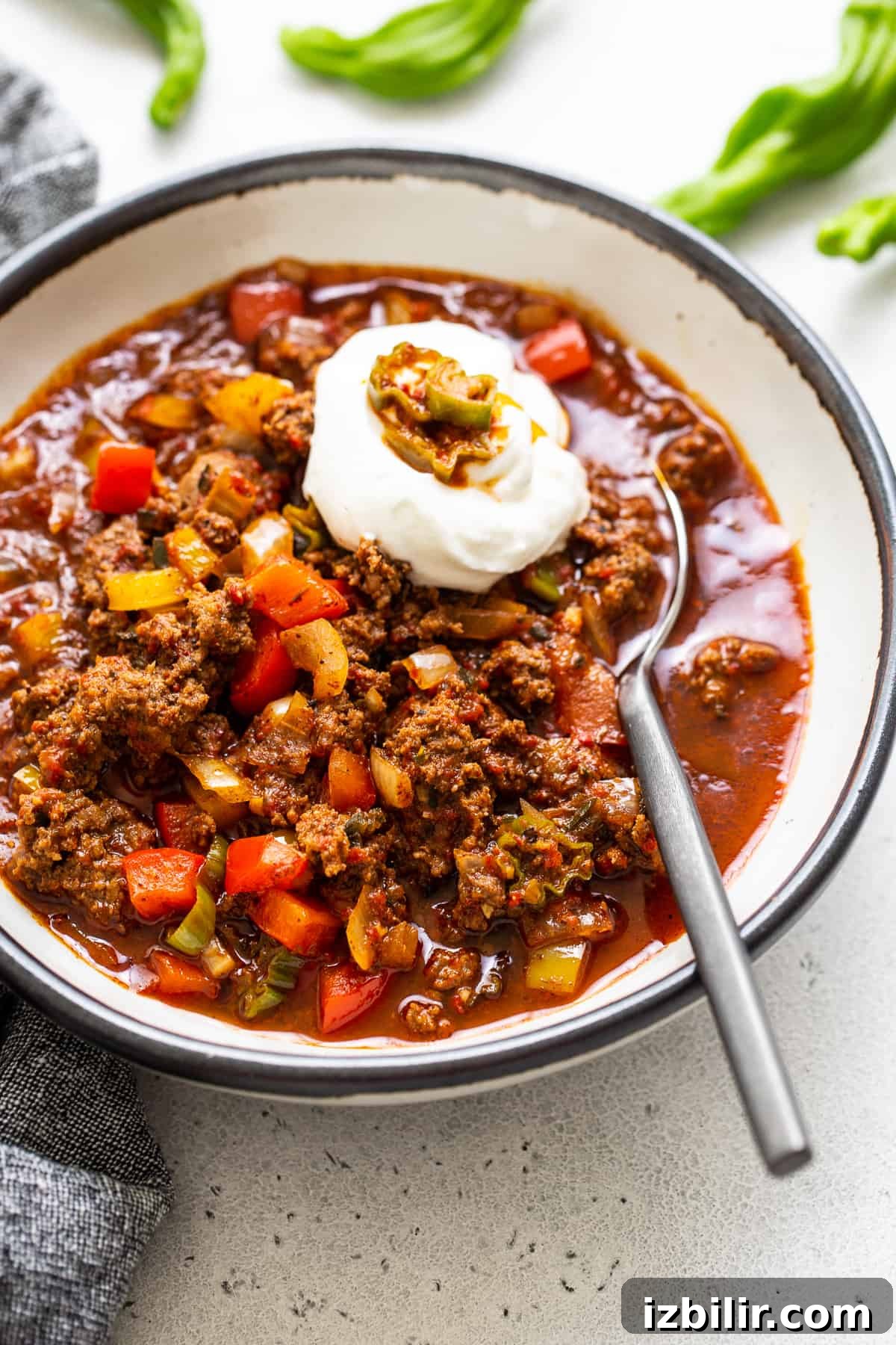 Authentic Texas Chili Recipe with Smoky, Spicy Flavor 2 Texas chili in a bowl with sour cream on top