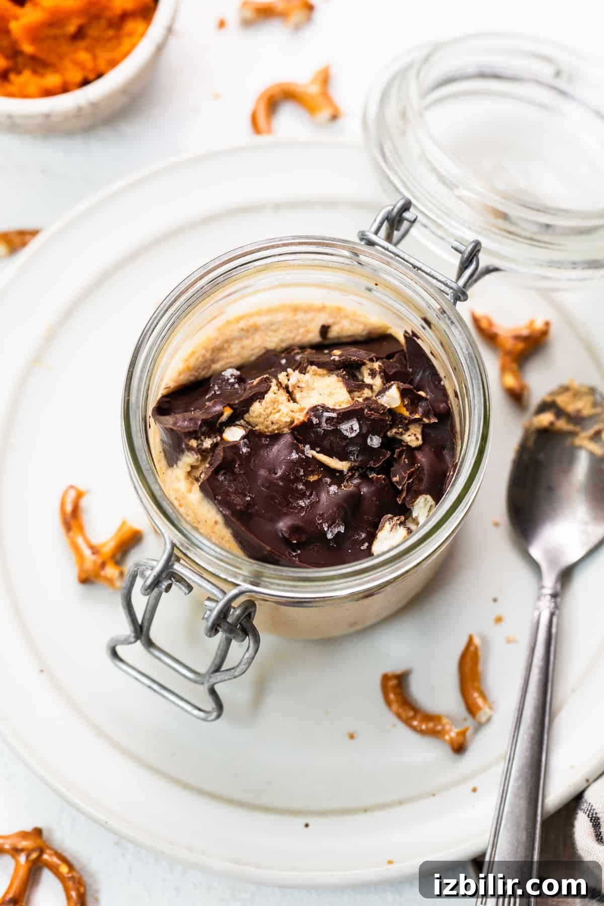 Pumpkin mousse in a jar with chocolate topping.