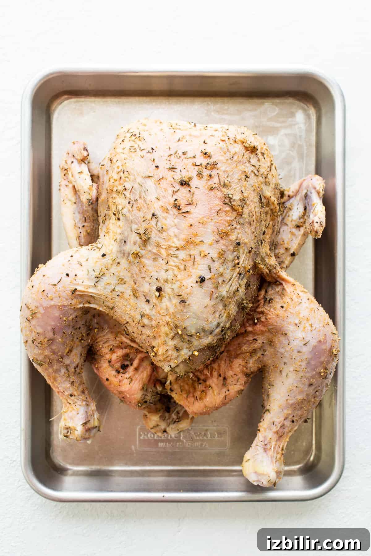 whole chicken on sheet pan.