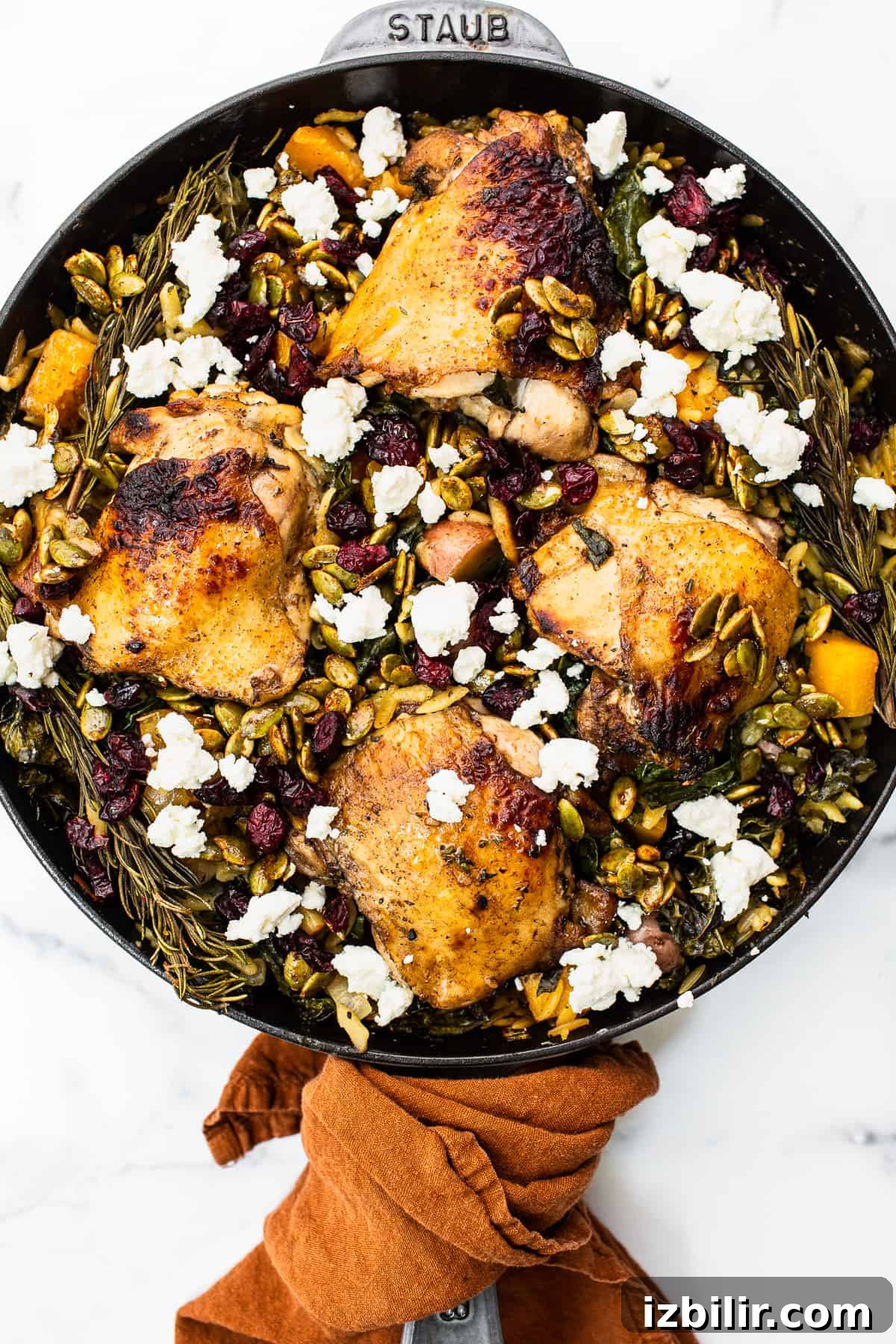 Harvest Orzo Skillet with Roasted Vegetables and Herbs 2 Harvest orzo chicken skillet topped with goat cheese.