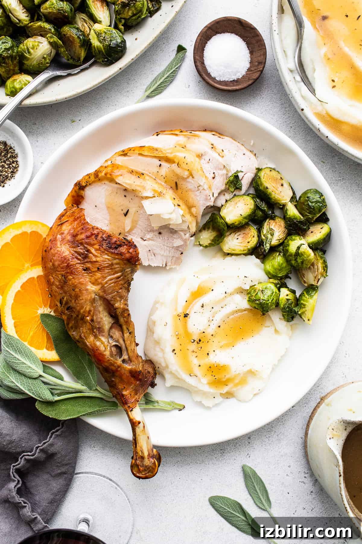 Learn how to dry brine a turkey with this simple tutorial. Dry brine turkey comes out so moist and juicy all thanks to the salting and resting process of a dry brine. thanksgiving plate on counter.