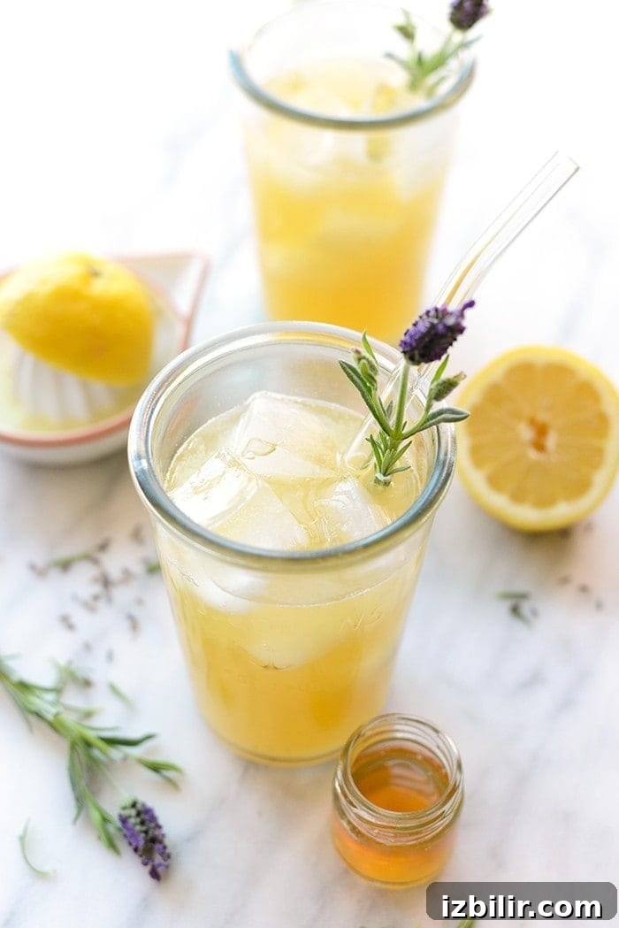 Honey Lavender Lemonade with dried lavender and small jar of honey