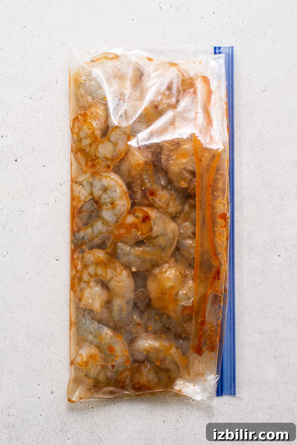 shrimp marinating in sauce.