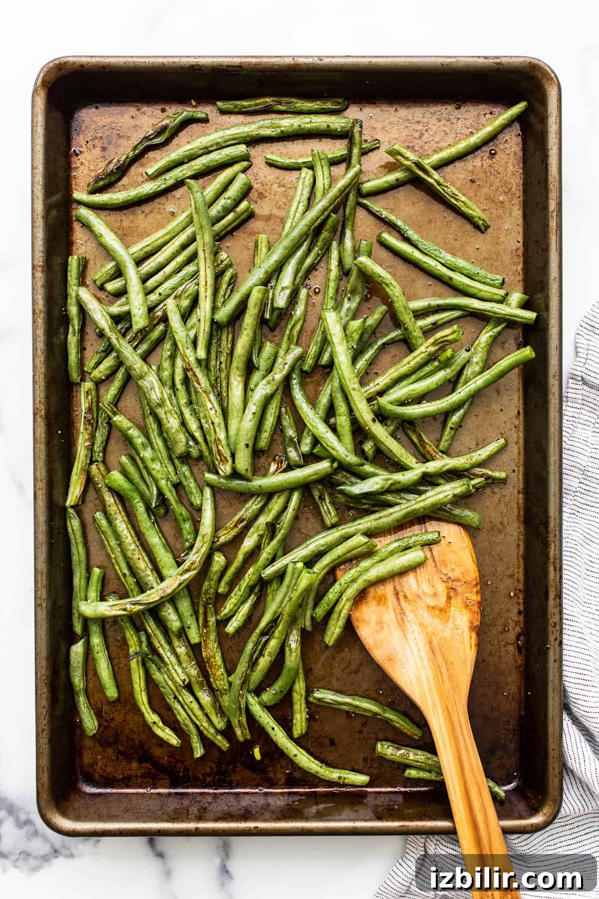 Green beans on a baking sheet.